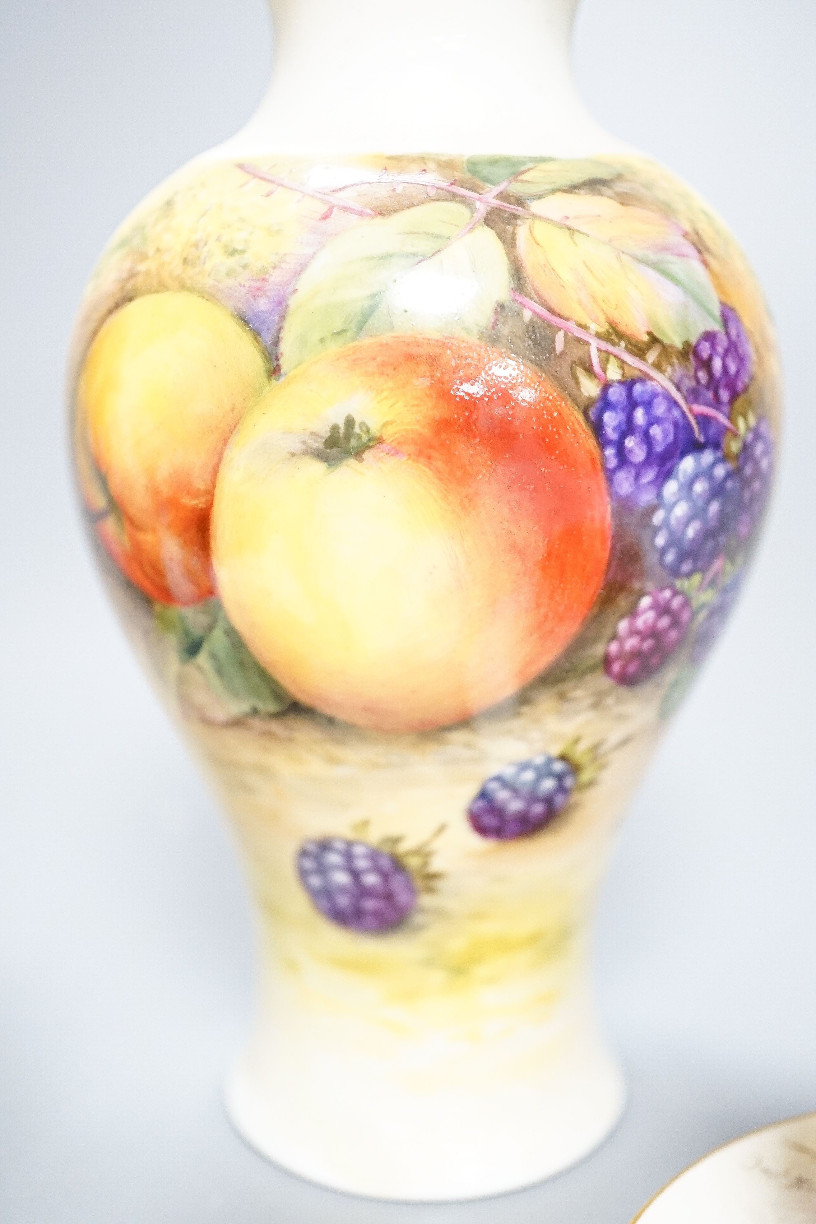 A Royal Worcester fruit painted small pot pourri and cover, 10.9cm high and a similar vase, 15cm, a Royal Worcester miniature cup and saucer, painted with pheasants, signed James Stinton and Grainger & Co pheasant vase